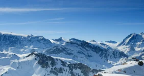 Blue sky and white peaks in the Alps