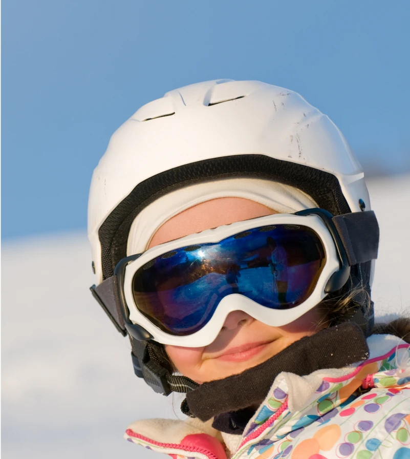 Child wearing ski goggles