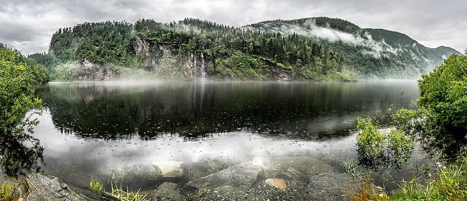 A wide landscape view of Myrkdalsvatnet lake in the Myrkdalen valley, Norway